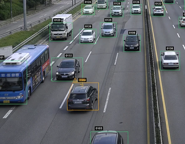 Computer vision detecting and tracking cars on a highway with labeled bounding boxes