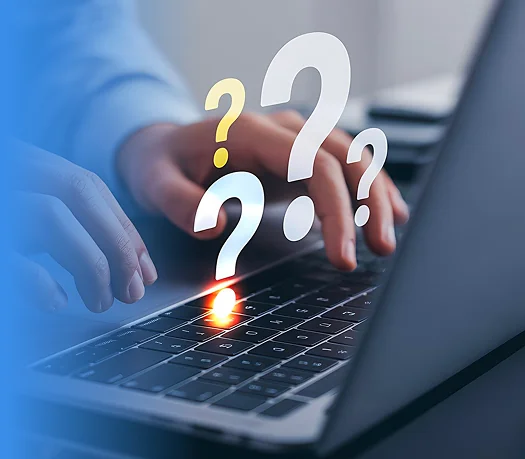 Hands typing on a laptop with glowing question marks floating above the keyboard